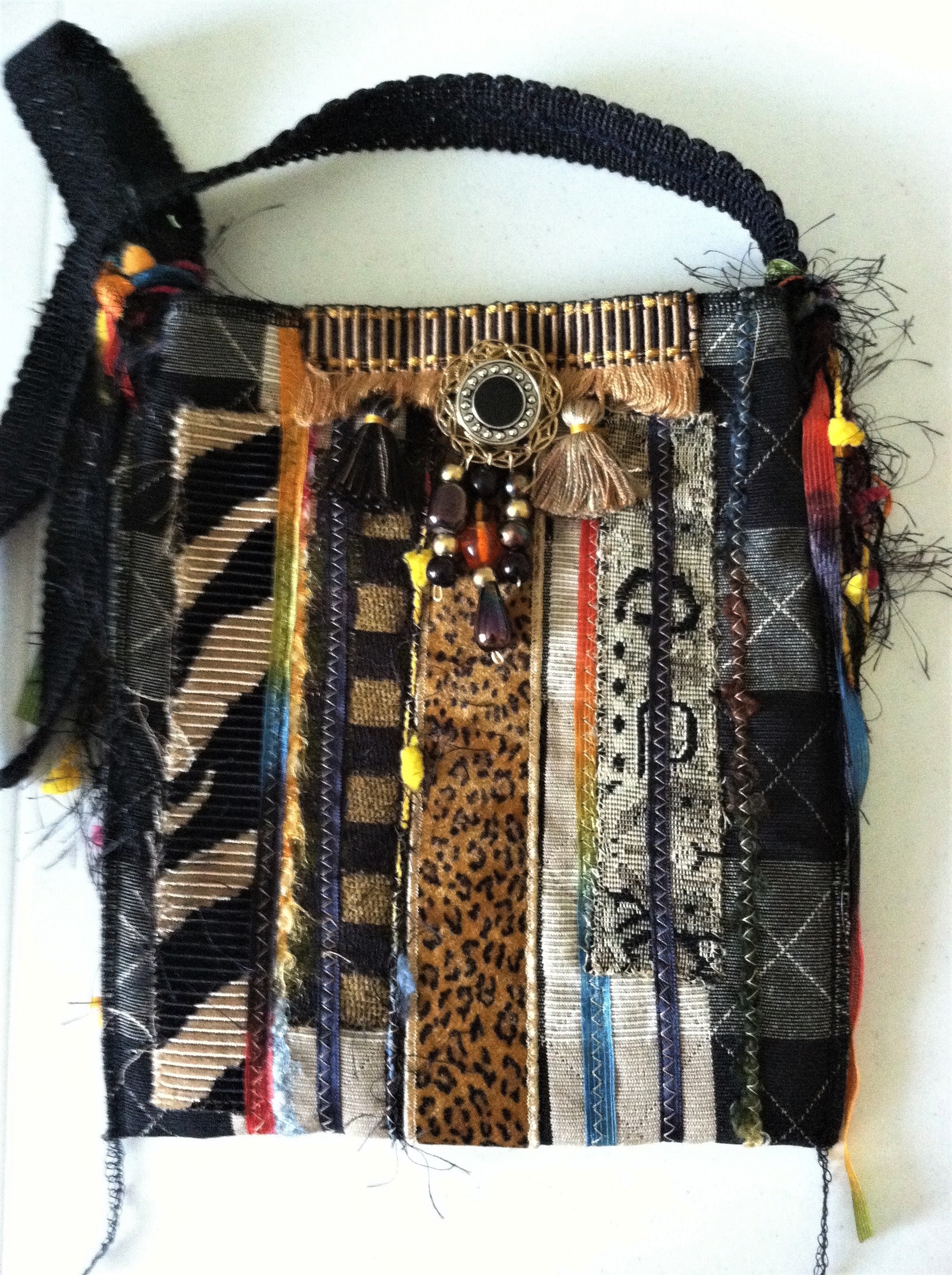 Decorative bag with multicolored patterns and textures on a white background